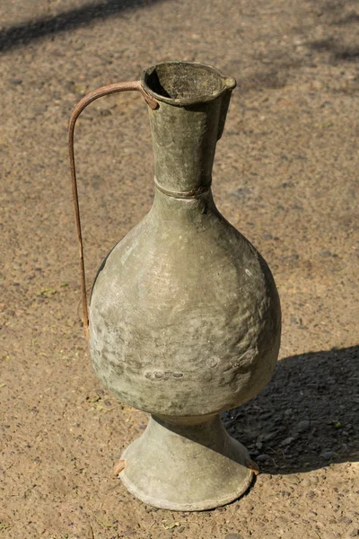 Ancient metal jug in oriental style — Stock Photo, Image