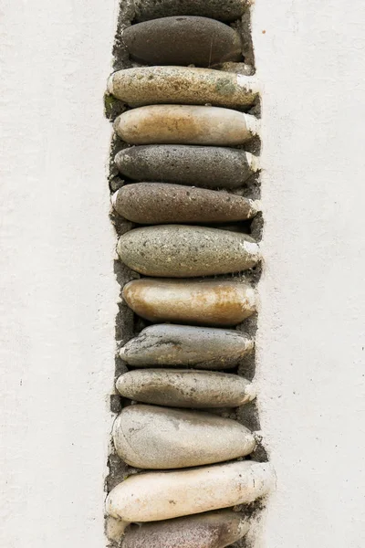 Muur gemaakt van het zelfde type van steentjes — Stockfoto