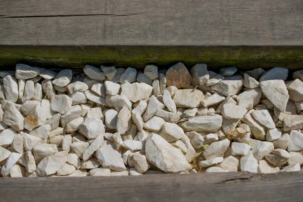 Bakgrund full av små vita stenar — Stockfoto