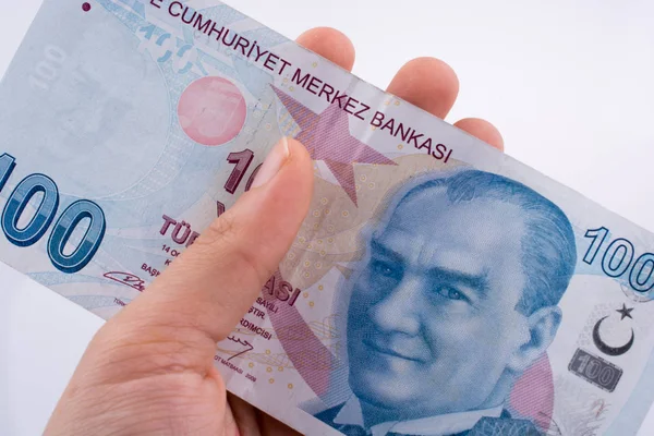 Ręka trzyma 100 banknotów brat i siostra Lira w ręku — Zdjęcie stockowe