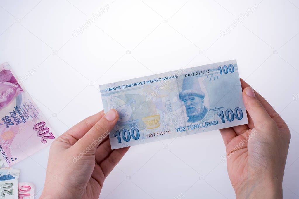 Hand holding Turksh Lira banknote  in hand