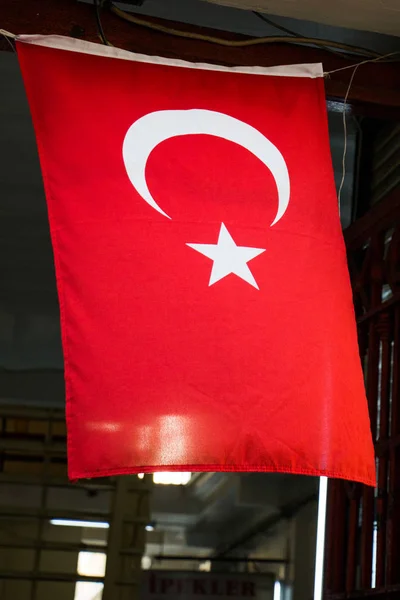 Turkish national flag hang on a rope in a building — Stock Photo, Image