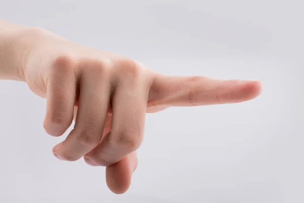 Mano apuntando sobre fondo blanco — Foto de Stock