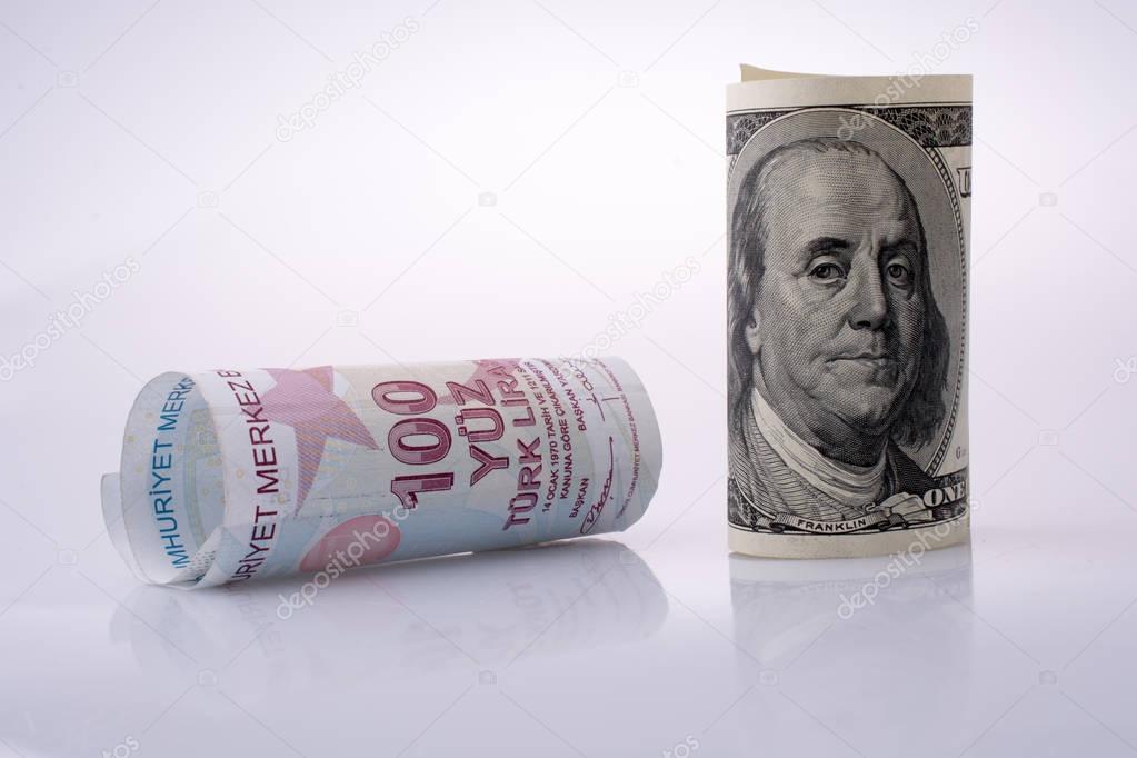 American dollar banknotes and Turksh Lira banknotes side by side