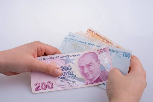 Billetes turksh lira en mano —  Fotos de Stock