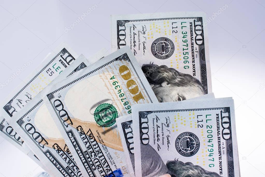  American 100 dollar banknotes placed on white background