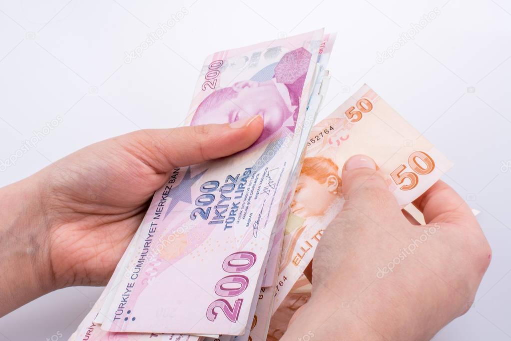 Hand holding Turksh Lira banknotes  in hand
