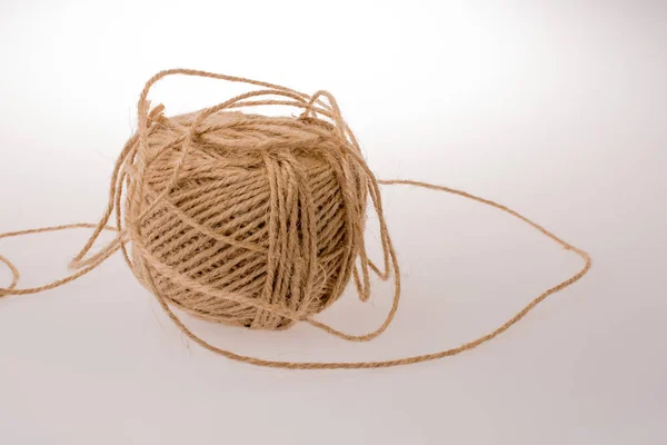 Roll of brown color linen string on white background — Stock Photo, Image