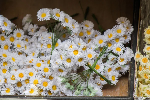 fake flowers in paper container