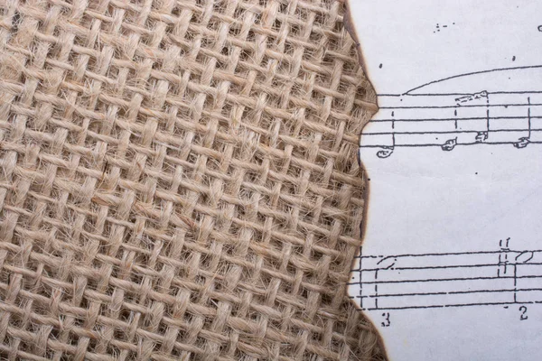 Musical notes on paper placed on a  canvas