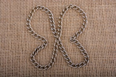 zincir formes bir kelebek keten tuval üzerine rakam