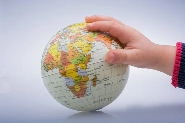 Child holding a globe in his hand — Stock Photo, Image