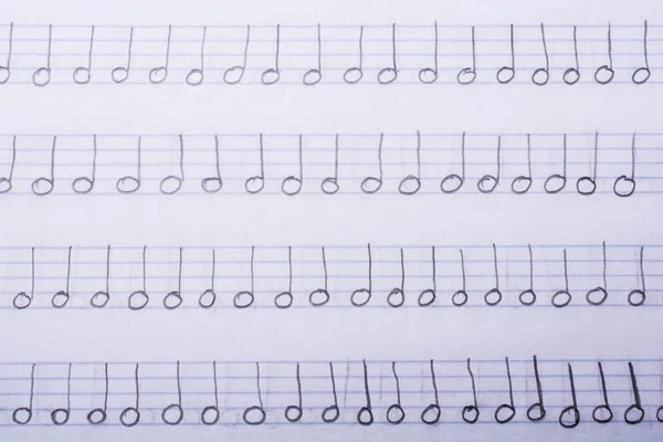 Las notas musicales escritas a mano están en papel — Foto de Stock