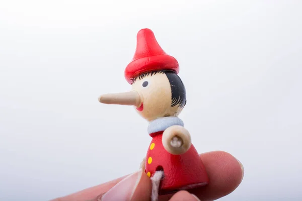 Mano Donna Con Pinocchio Sfondo Bianco — Foto Stock