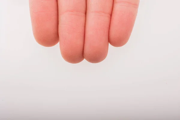 Vier vingers van een menselijke hand deels gezien in het licht — Stockfoto