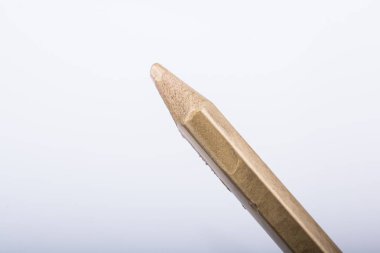 Altın renkli kalem elinde tutan el