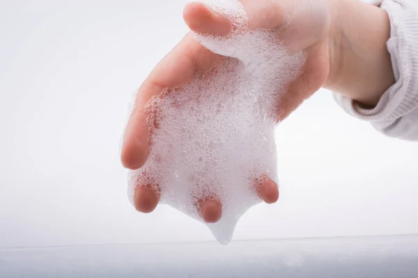 Child washing hands  in foam — Stock Photo, Image