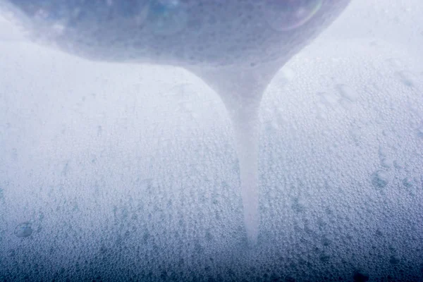 Water covered with foam of shampoo — Stock Photo, Image