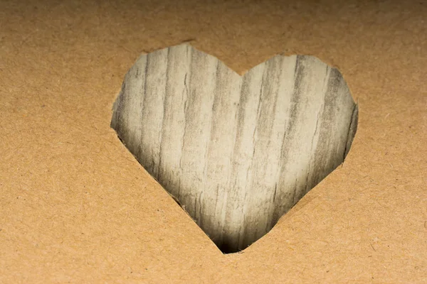 Heart shaped cut out of a cardboard — Stock Photo, Image