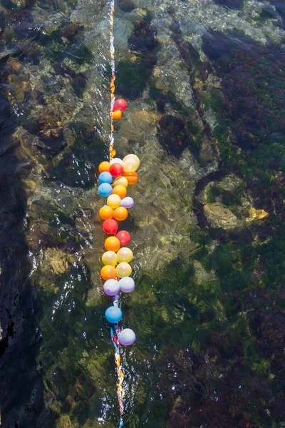Balloons as targets on water
