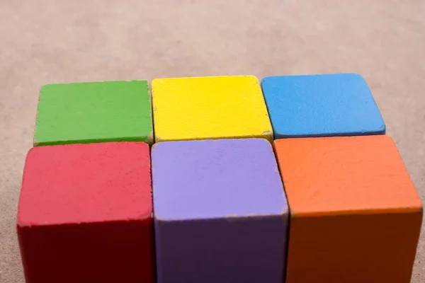 Colorful building  blocks on brown background — Stock Photo, Image