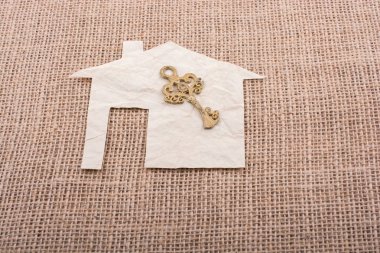 Tuval arka plan üzerinde ev şekildeki Retro anahtar