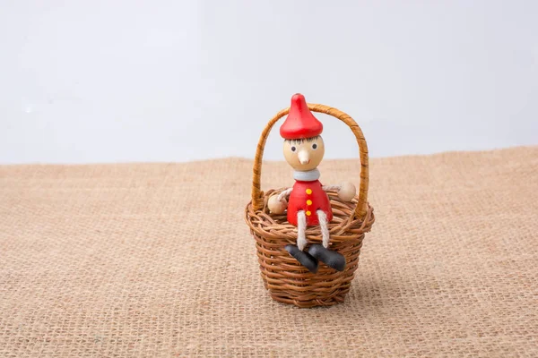 Pinocchio Sitting Mini Basket Canvas — Stock Photo, Image