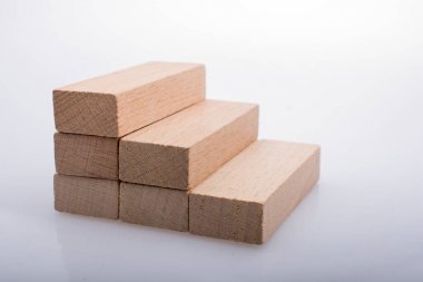 Wooden domino blocks on white background clipart
