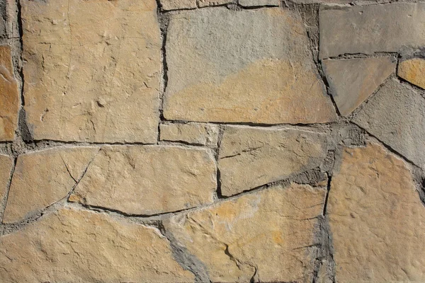 Vägg av samma typ av stenar — Stockfoto