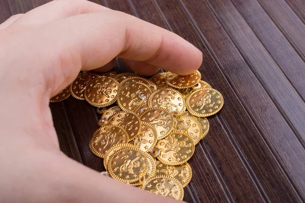 Plenty of fake gold coins in hand