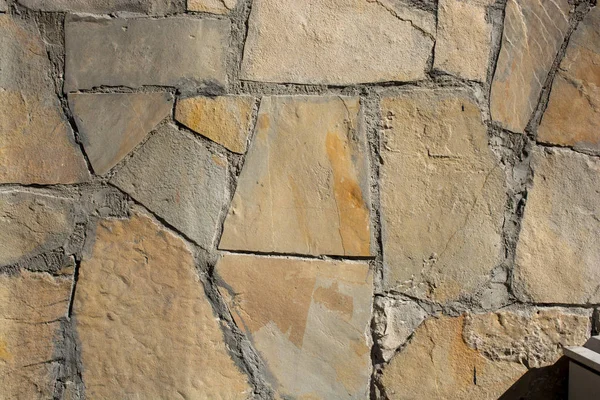 Wall made of the same type of stones — Stock Photo, Image