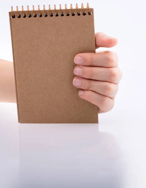 Hand Holding Brown Color Notebook White Background — Stock Photo, Image