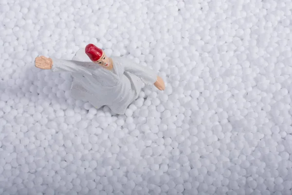 Sufi Whirling Dervish on little white polystyrene foam balls