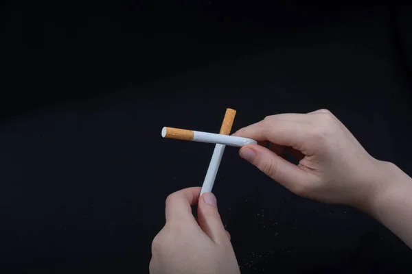 Hand Holding Crossed Cigarettes Black Background — Stock Photo, Image
