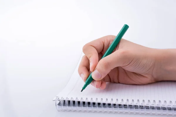 Escrita Mão Caderno Com Uma Caneta Fundo Branco — Fotografia de Stock