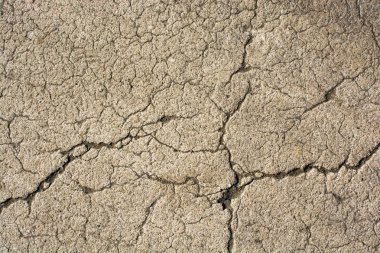 Arka plan deseni olarak çatlamış beton yüzey