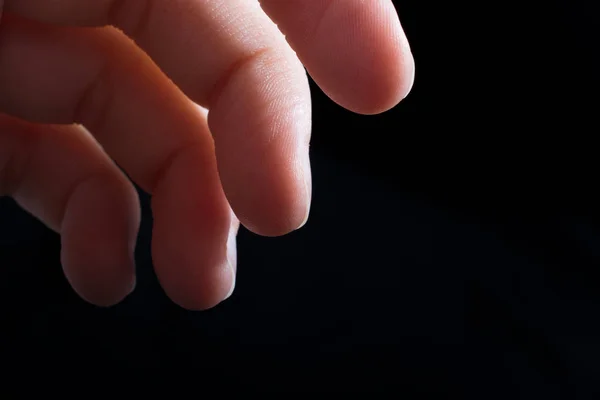 Four fingers of a human hand partly seen in view — Stock Photo, Image