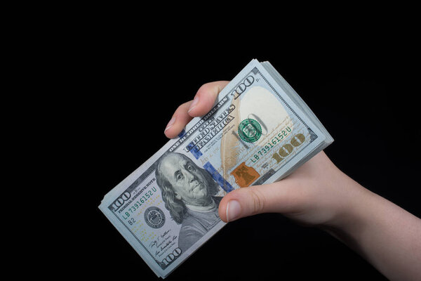 Hand holding American dollar  isolated on white background