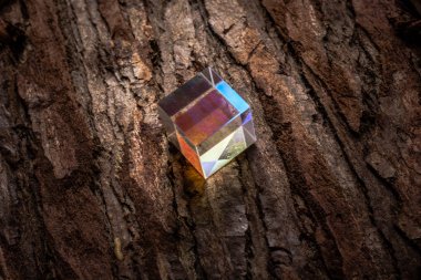 Colorful bright glass prism cube  Refracting light in vivid rain clipart