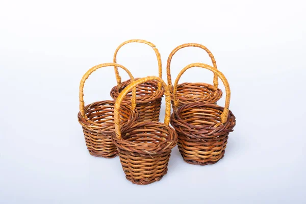 Empty wicker baskets on a white background — Stock Photo, Image