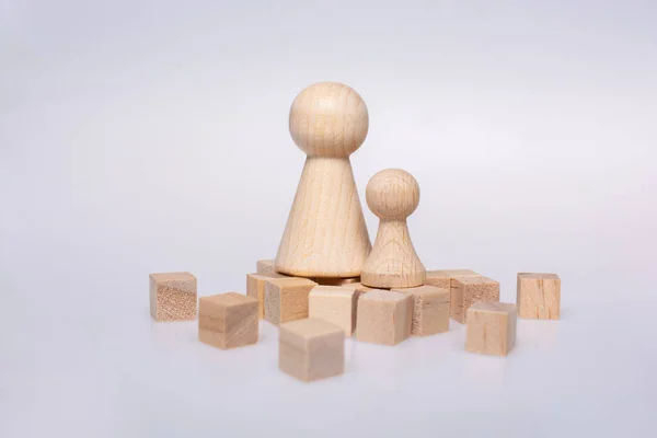 Wooden cubes and  figurines of people as family concept — 图库照片