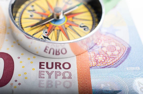 Euro banknotes with Euro Compass currency finance direction