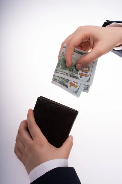白い背景にドル紙幣と財布を持つビジネスマン — ストック写真