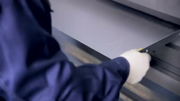 Worker hands bend metal sheet on a modern bending industrial machine at a factory. — Stock Video