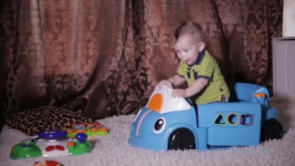 Baby child playing with a toy truck. — Stock Video