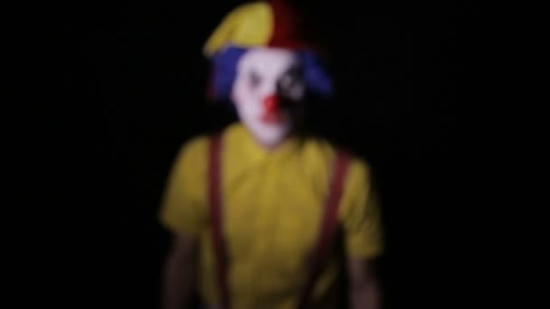 Scary clown screaming into camera faces. Close-up. — Stock Video
