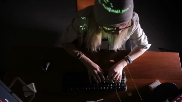 Hacker, programmer working with data code in a dark room. Hackers desk. — Stock Video