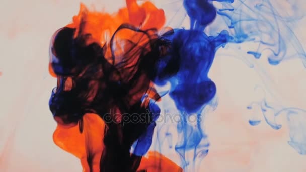 Red and blue ink in water. Creative videobackground. Slow motion. — Stock Video