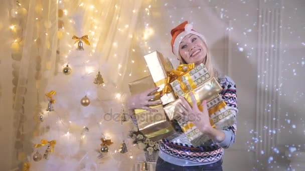 Joyful funny girl throws up lot of gifts, excited about them. — Stock Video