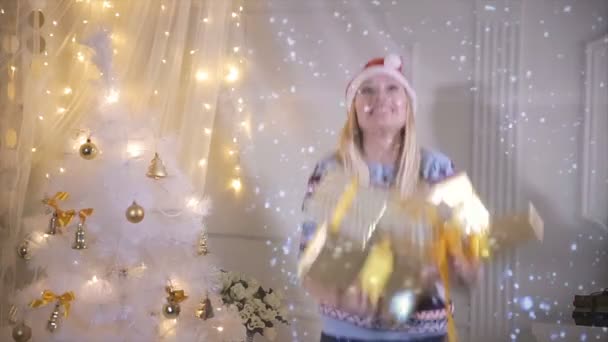 Joyful funny girl throws up lot of gifts, excited about them. — Stock Video